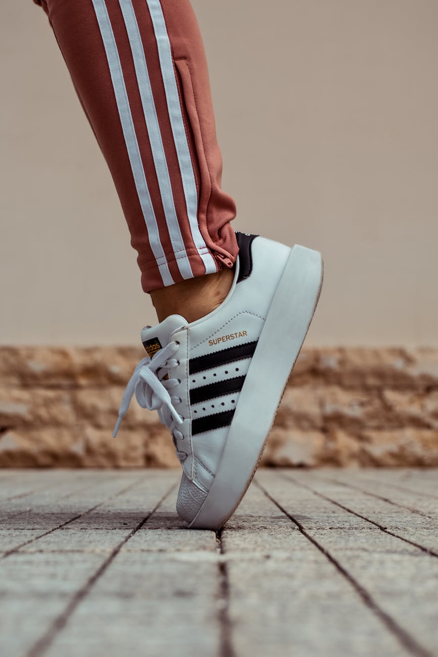 close up photo of adidas shoes